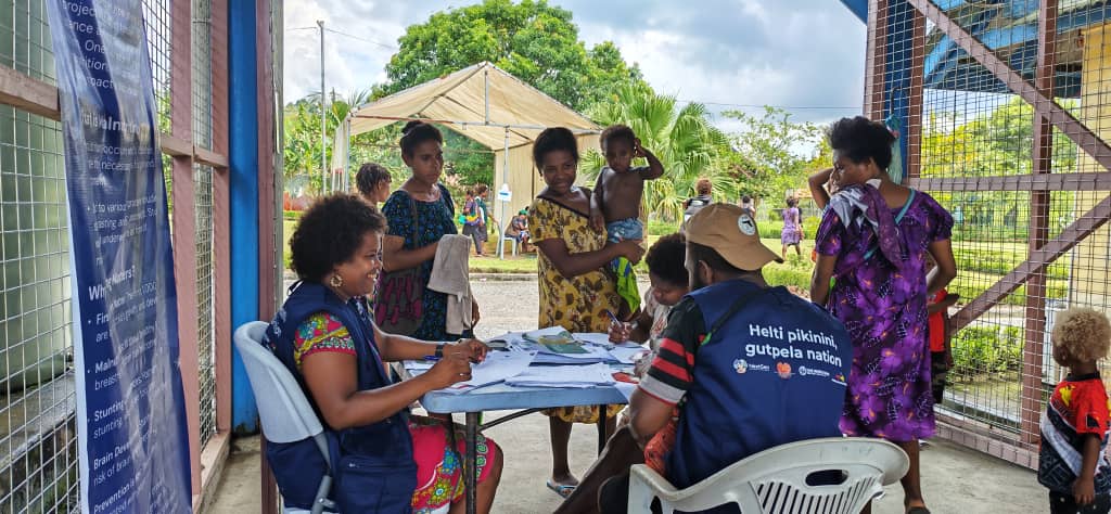 Health workers assisting families